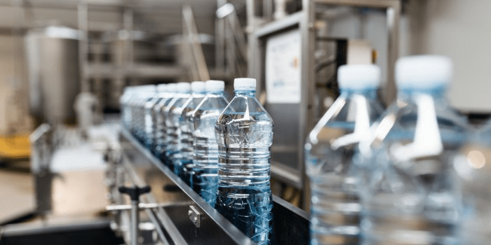 plastic water bottles on a conveyor belt