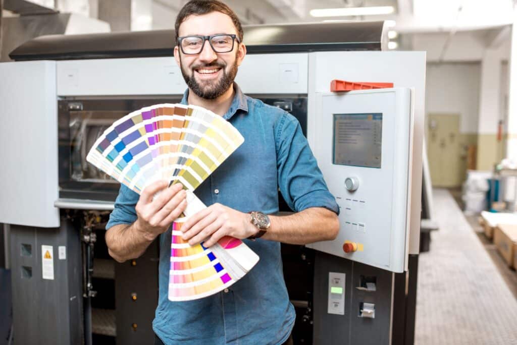 typographer-with-color-swatches-at-the-manufacturing facility