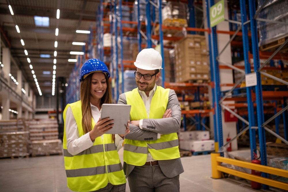 warehouse managers using edi portal on tablet