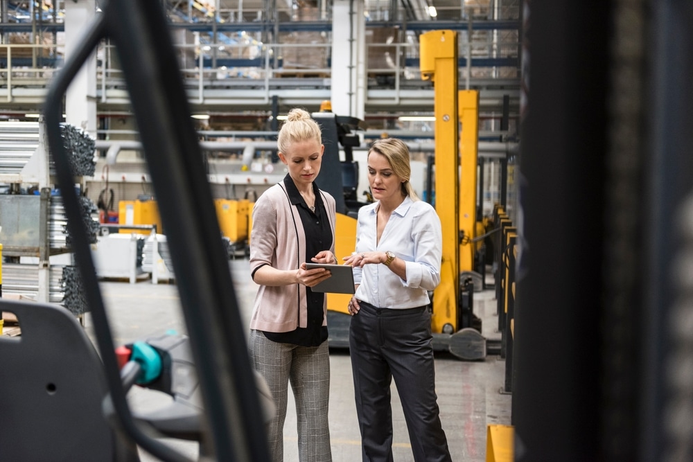 female manufacturing shop floor managers using tablet