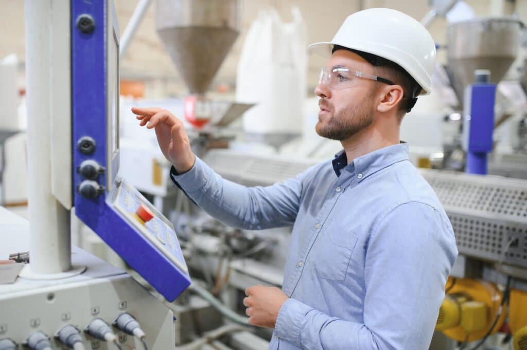 worker using manufacturing shop floor management computer