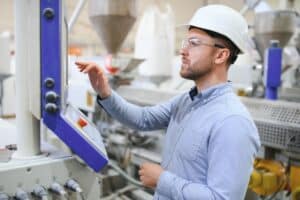 worker using manufacturing shop floor management computer