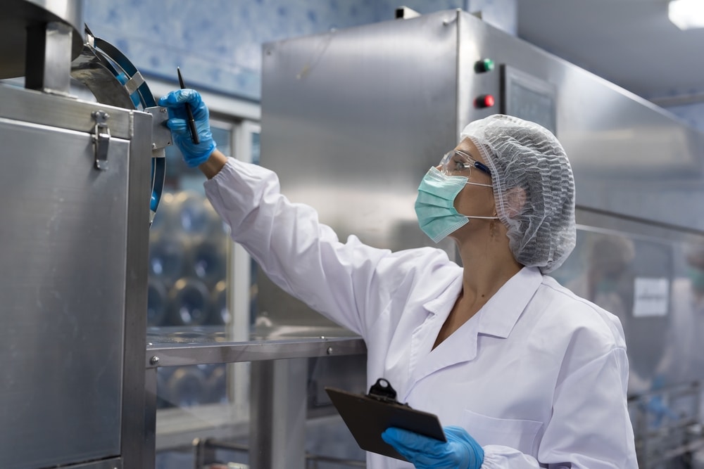 female lab performing gmp inspection