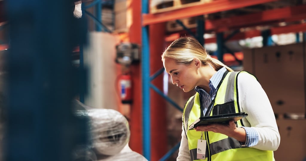 female warehouse worker cycle counting