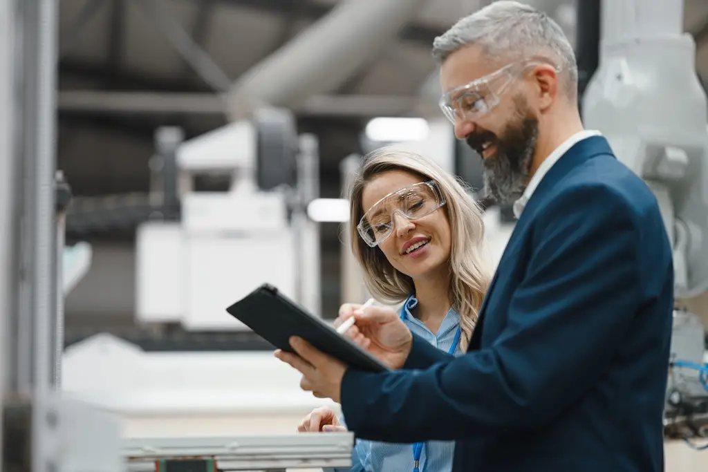 male and female in third-party manufacturing meeting