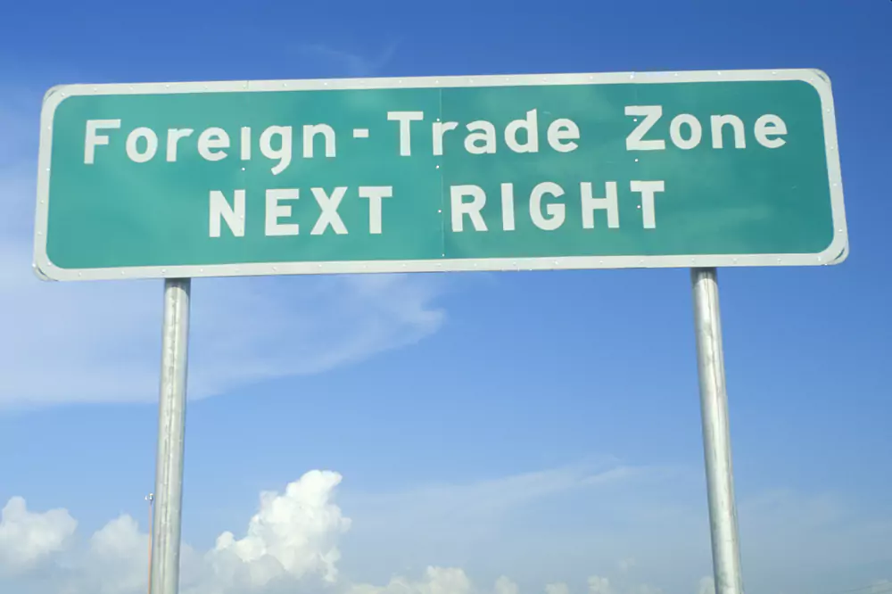 road sign that says Foreign Trade Zone NEXT RIGHT